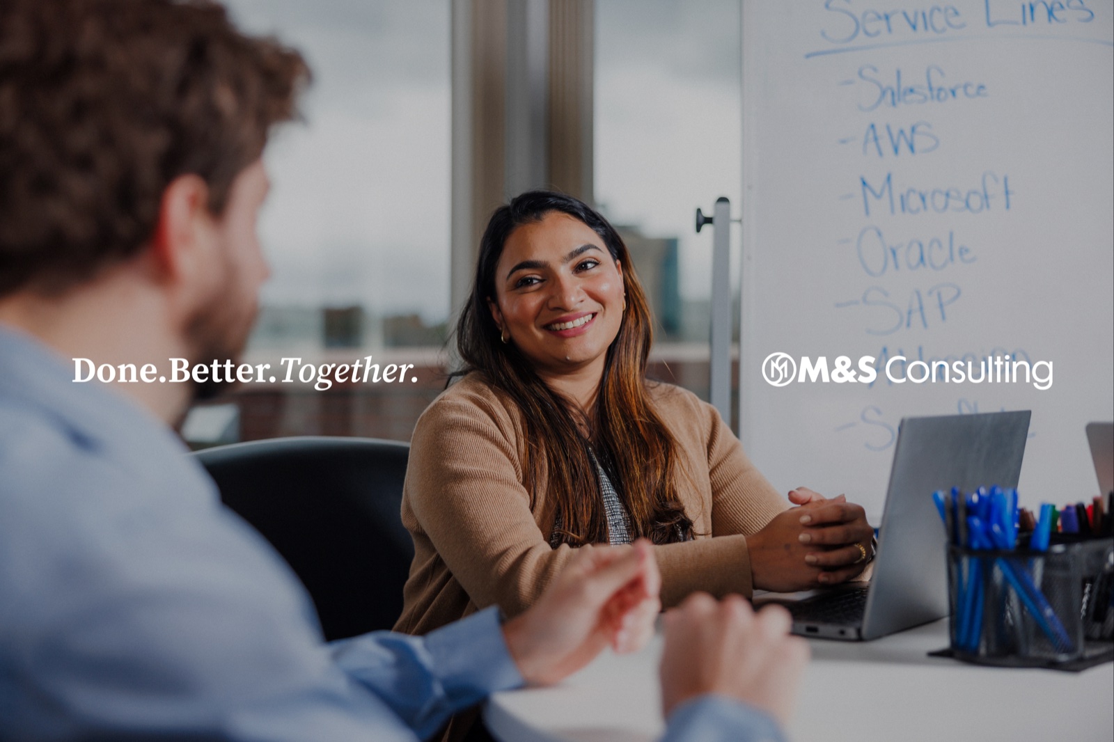 M&S consultant in a client meeting