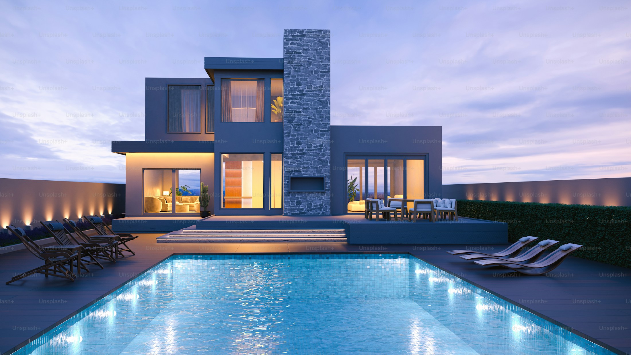Modern residence glowing beside a still pool